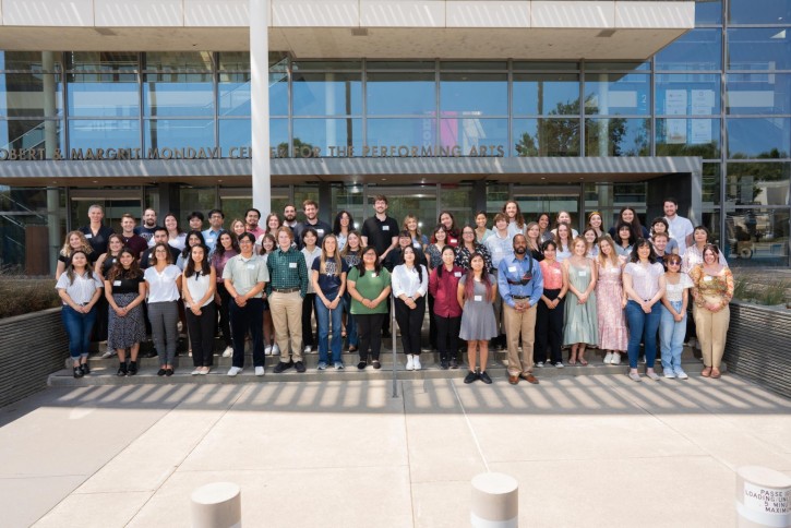 Teaching credential candidates stand together on the steps outside of the Mondavi Center