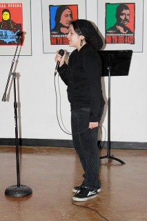 Young woman performing at Under-21 Open Mic