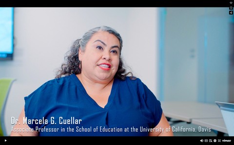 Dr. Marcela Cuellar in a blue shirt during an interview.
