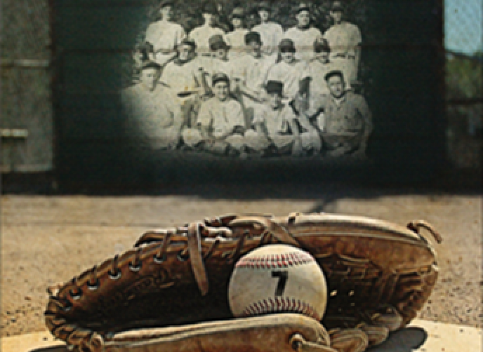 Baseball and glove resting on the ground