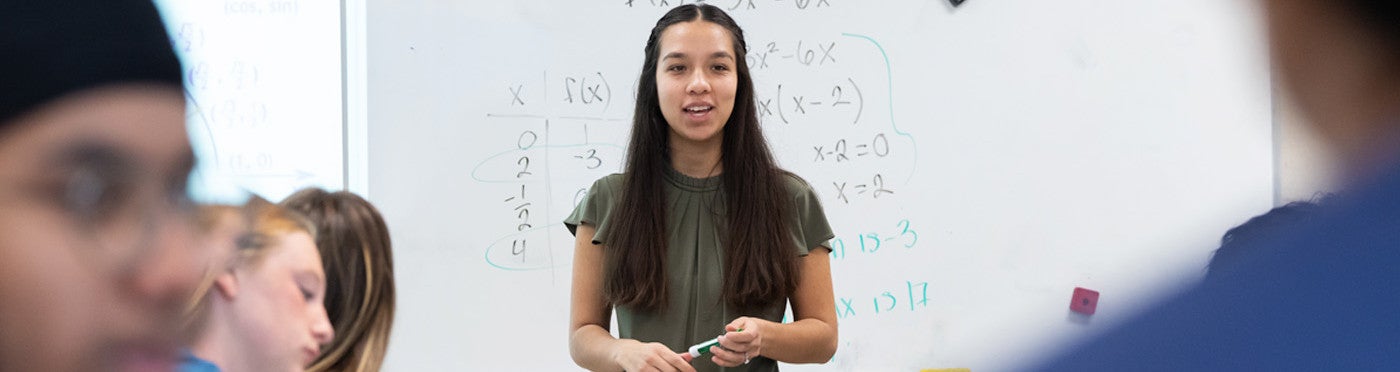 Credential alumni teaching in her high school math classroom