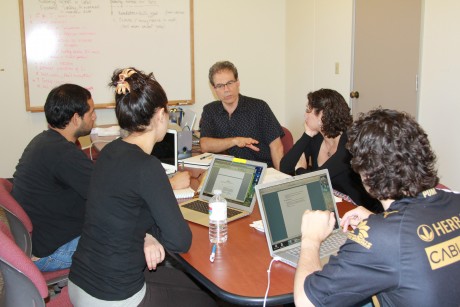 Professor Steven Athanases (center) talks with his undergraduate research team.