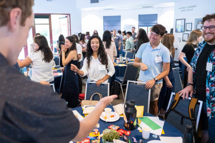 Students smile and dance.