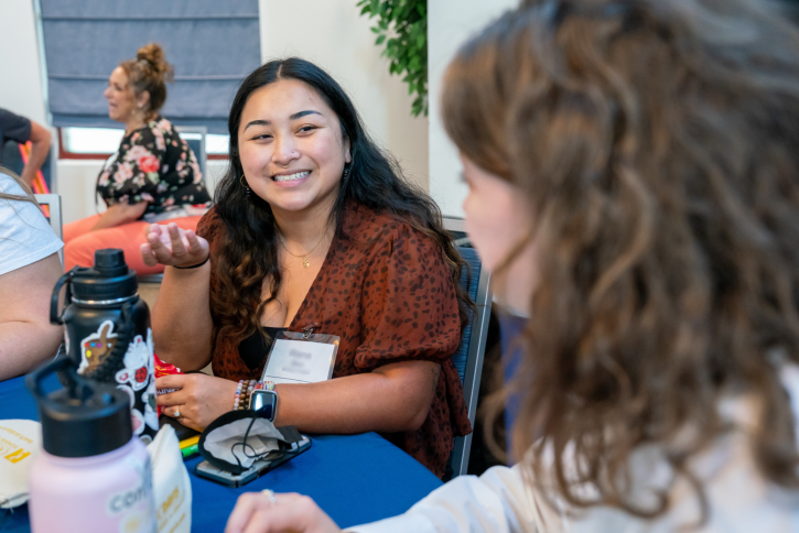 Students talk at the table