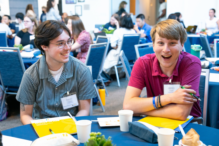 Two students laugh