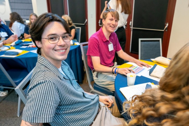 Students smile at the camera