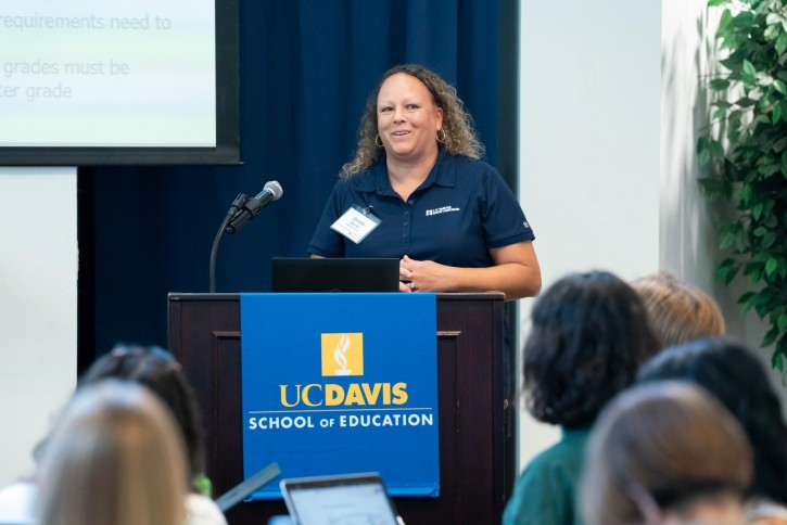 Janelle Barnes speaks to the group.