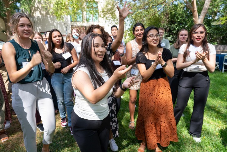 Students, staff, and faculty cheer.