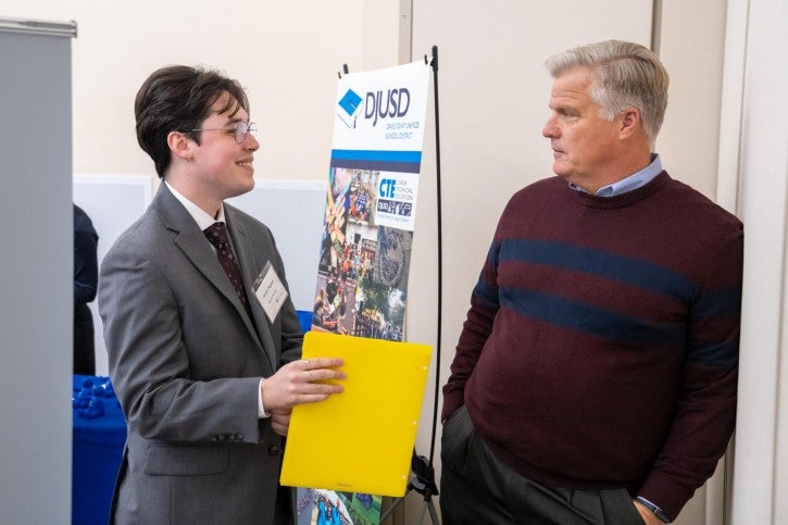 A student and a school rep chat.