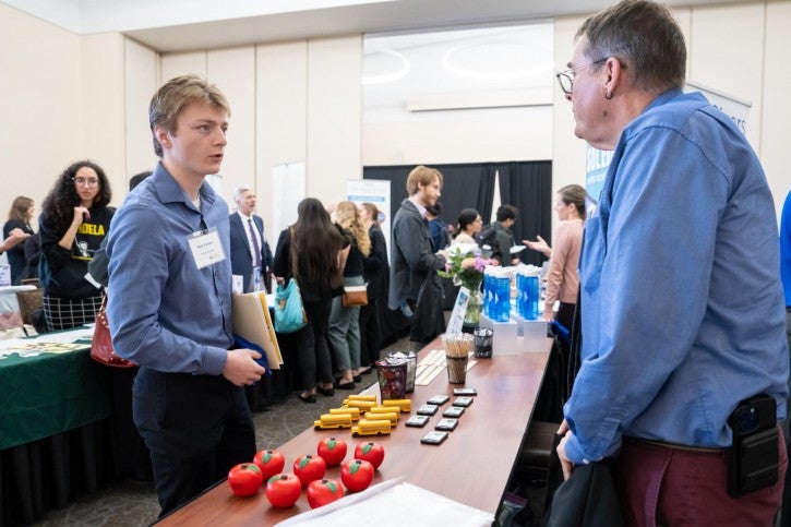 A student talks to a district rep.