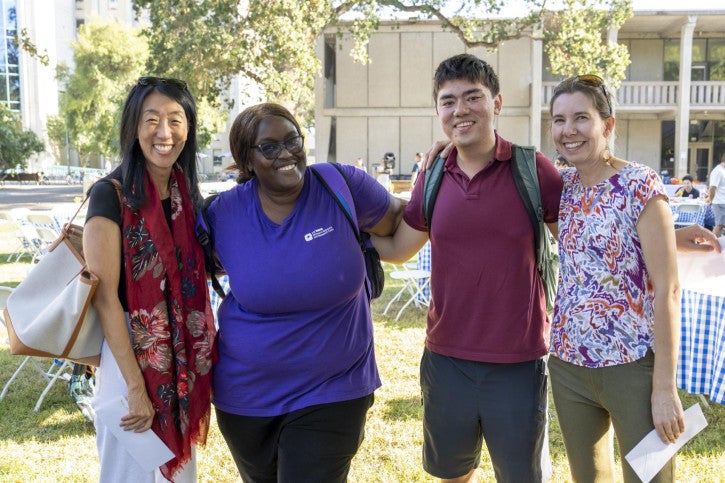 Dr. Nancy Tseng poses for a photo with three credential students.
