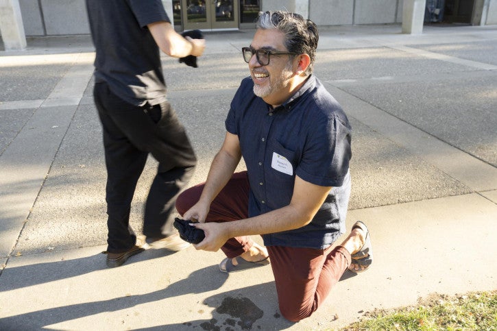 Danny Martinez participates in a game where he has to defrost a frozen t-shirt and put it on.