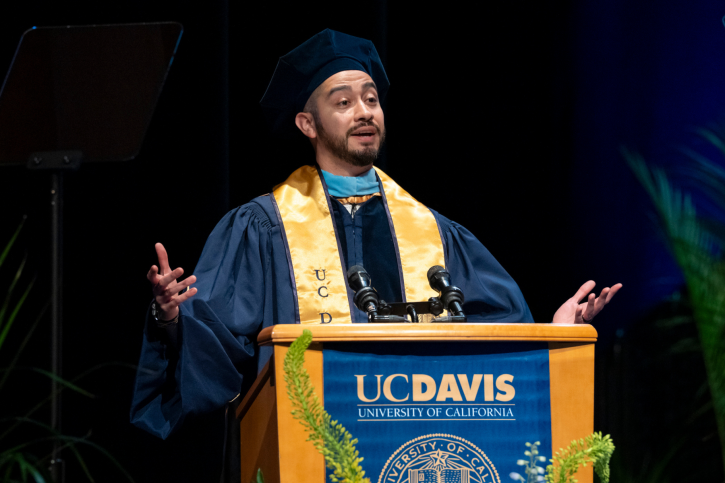 Student speaker Jaime Ramirez-Mendoza speaks from the stage.