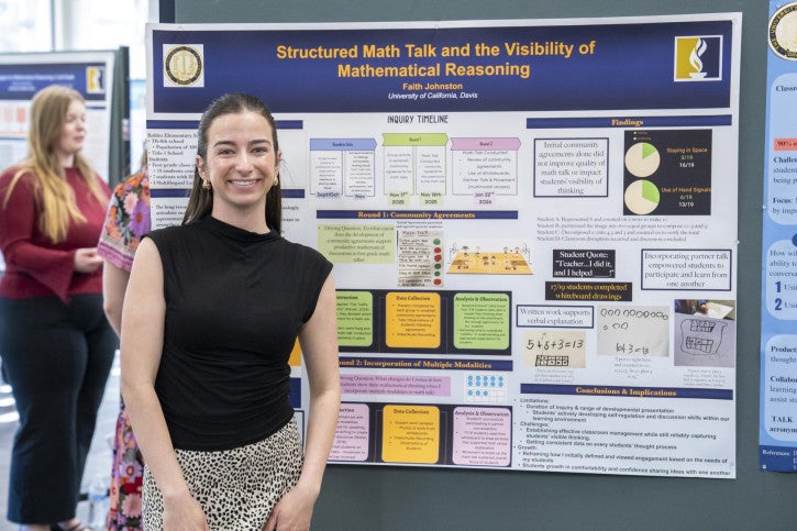 A woman smiles in front of an academic poster titled "Structured Math Talk and the Visibility of Mathematical Reasoning."