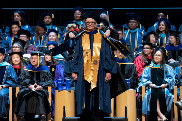 A doctoral student receives her stole.