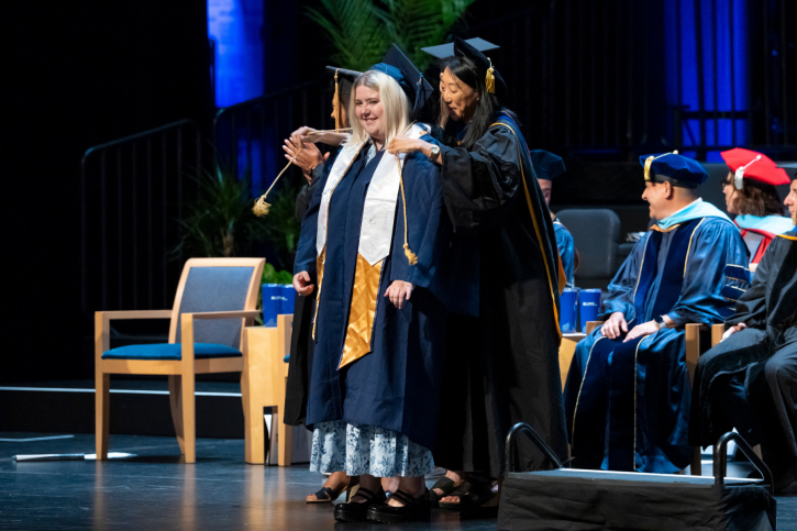 Credential student Katie receives her cord.