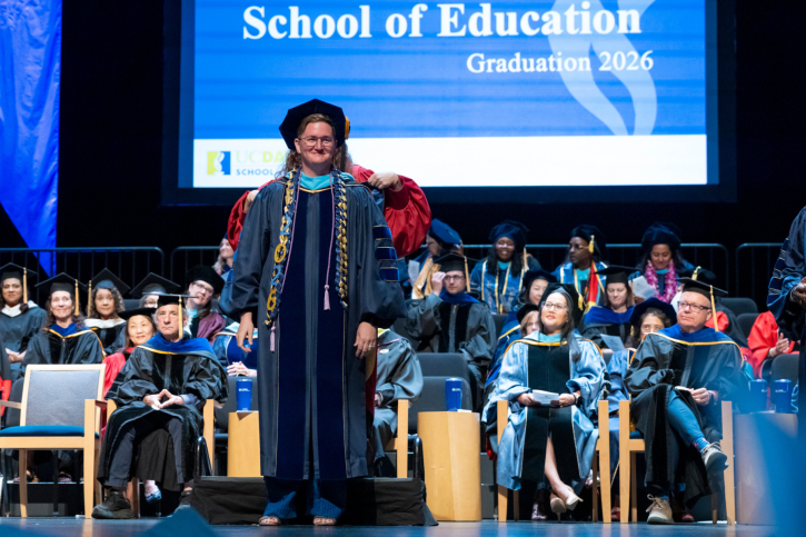 EdD grad Camden receives their stole.