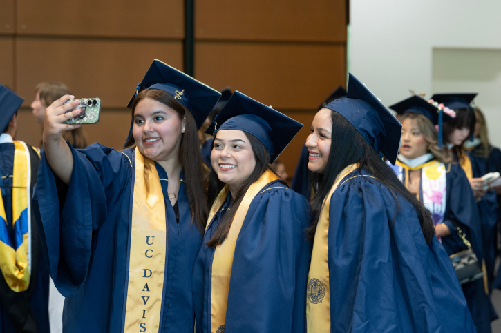 Three credential grads take a selfie.