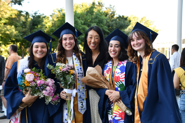 Dr. Nancy Tseng smiles with four of her credential grads.