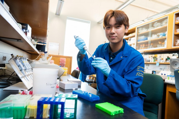 David fills a small tube with a syringe