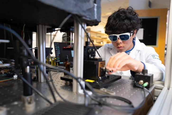 Eric wears dark glasses and works with machinery