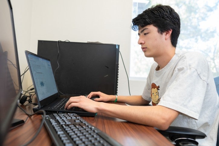 Student working on desktop computer