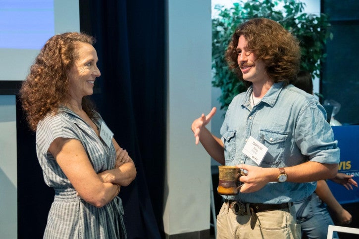 Multiple-subject credential lecturer and supervisor Lisa Sullivan speaks with a credential student during one of the kickoff breaks.