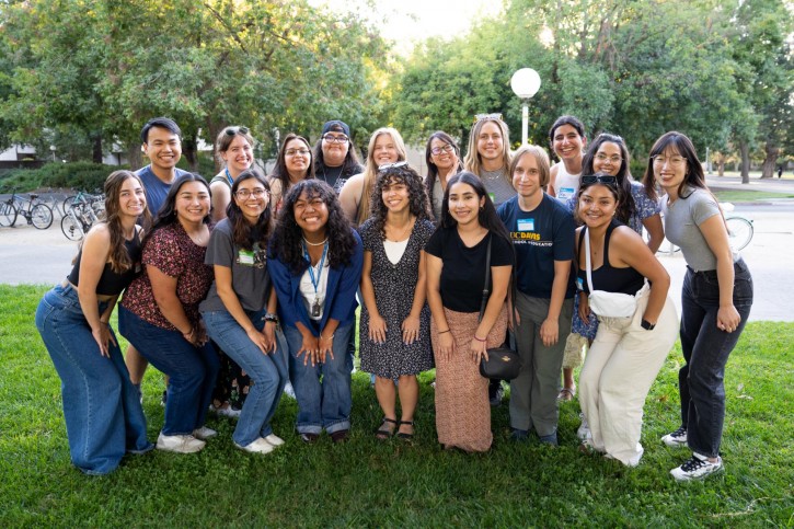 A group of teacher education students smile for the camera