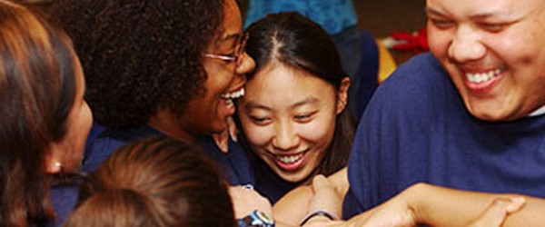 Group of students and teachers laughing