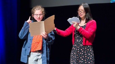 Presenter and student at Words Take Wing