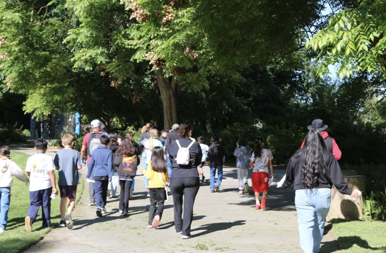 Students and parents walk around the UC Davis Arboretum.