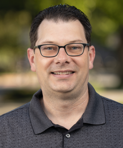 Headshot of Dan Comins