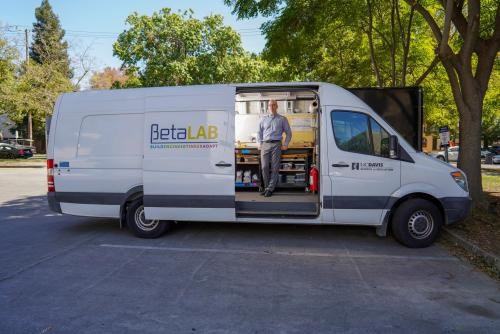 Lee Martin standing in the open doorway of his BETA Lab van