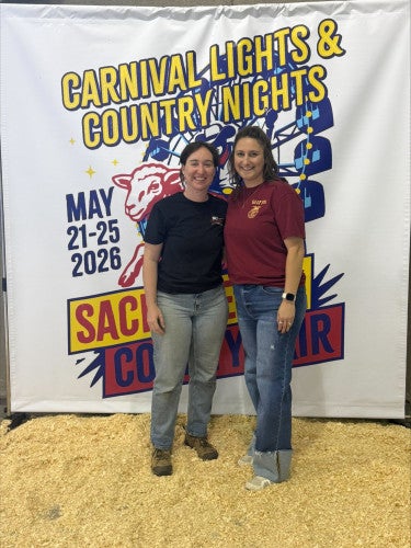 Caitlin Holder and Sarah Ronayne pose together for a photo.