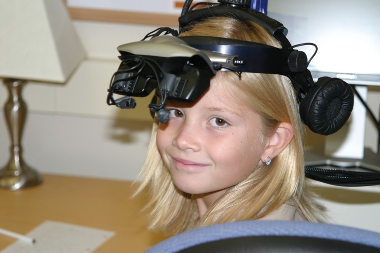 Portrait of child wearing psychometric head gear 