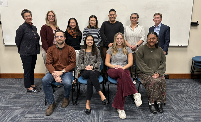 11 people pose together for a photo of the full student advisory council