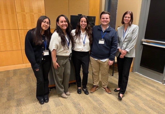 A group of SPEDDR Conference presenters pose for a photo together.